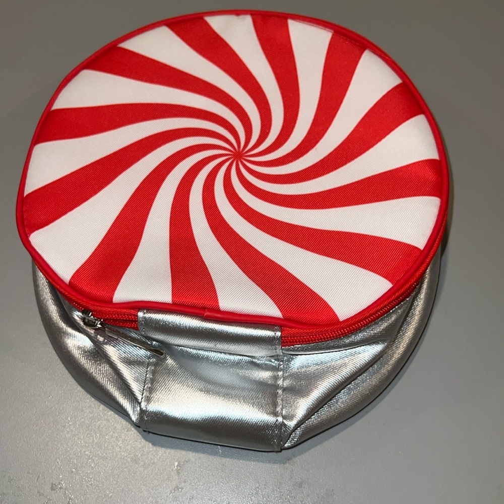 Clinique cosmetic bag designed to resemble the festive starlight peppermint.